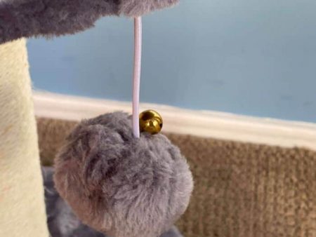 Kitty Cat Post Features a Pom Pom Ball