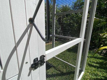 Majestic Chicken Coop features black latches and opening rod
